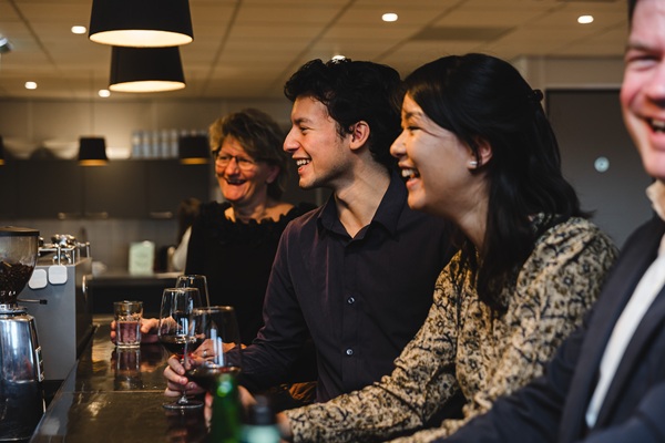 People at a bar laughing