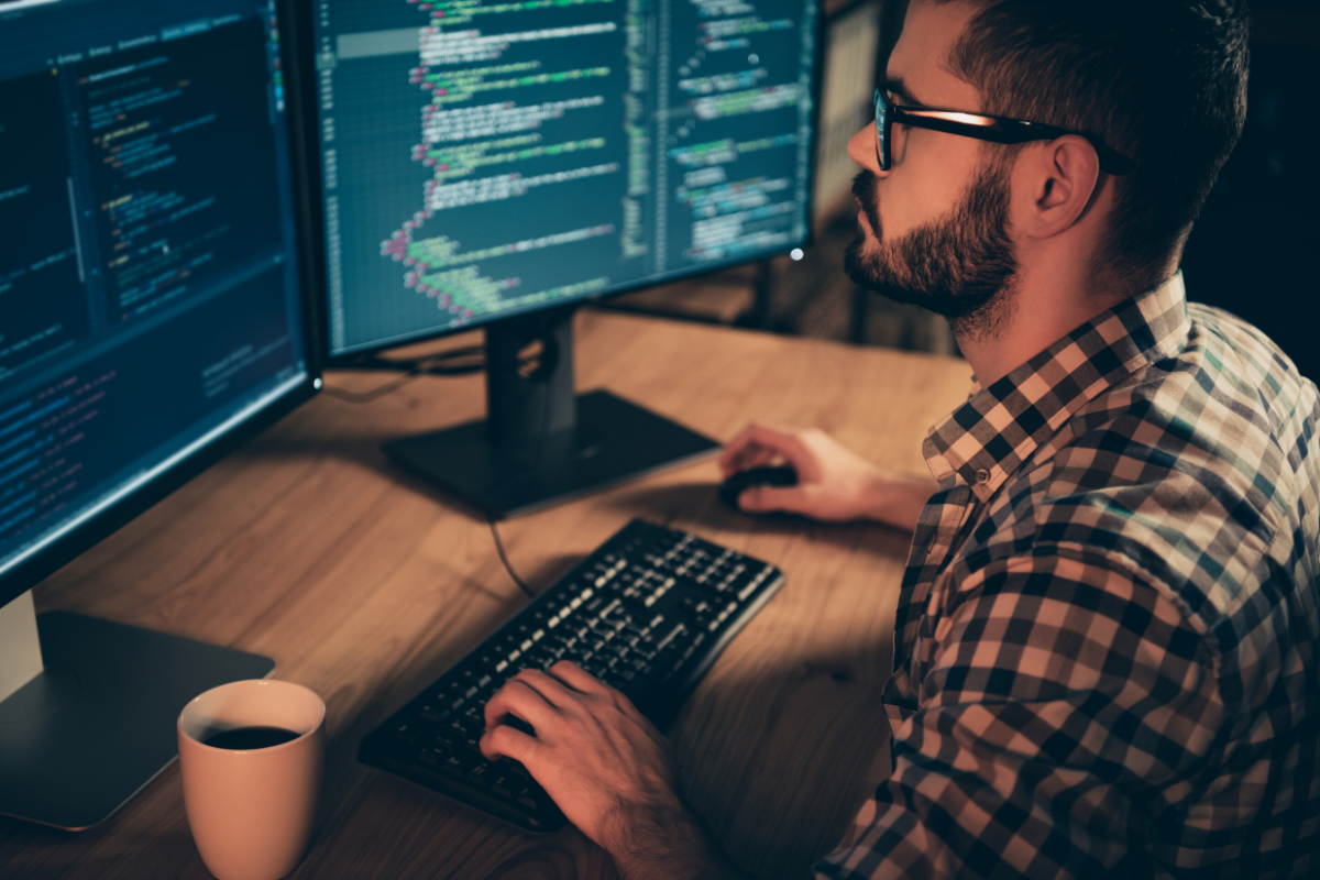 Software engineering working on his computer